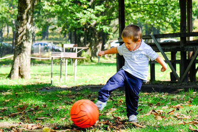 Boy looking away in park