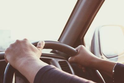 Close-up of hand holding car