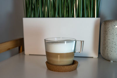 Close-up of coffee cup on table