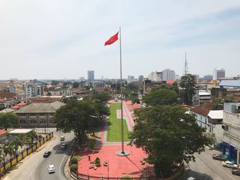High angle view of street and buildings against sky