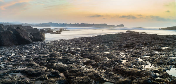 Scenic view of sea against sky during sunset