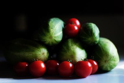 Close-up of cucumbers and tomatoes on table