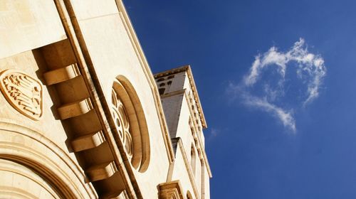 Low angle view of building against blue sky