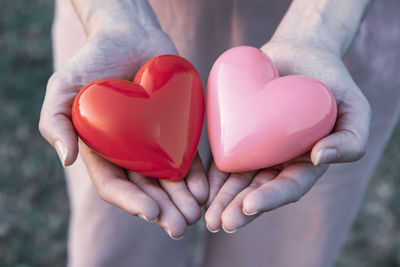 Close-up of woman hand holding heart shape