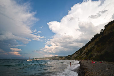 Scenic view of sea against cloudy sky