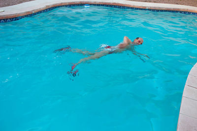 High angle view of man swimming in pool