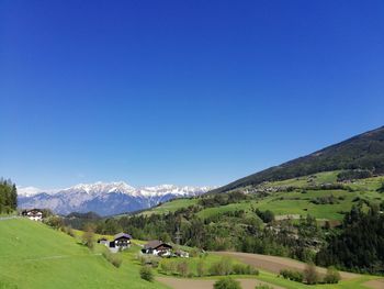 Scenic view of landscape against clear blue sky