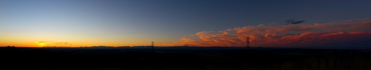 Silhouette landscape against sky during sunset