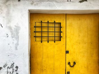 Close-up of yellow window of building