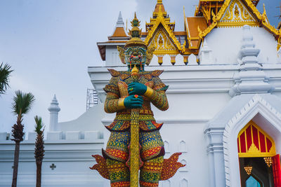 Low angle view of statue against building