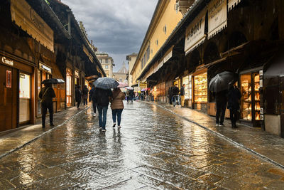 Rear view of man walking on street