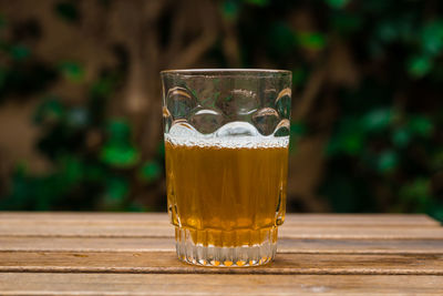 Close-up of beer glass on table