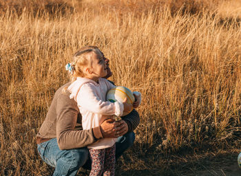 Happy father and child having fun playing outdoors. smiling dad and daughter spending time together 