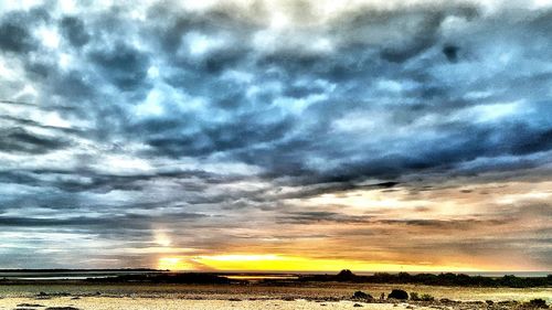 Scenic view of sea against cloudy sky