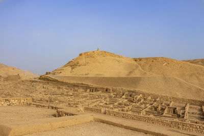 Scenic view of desert against clear sky