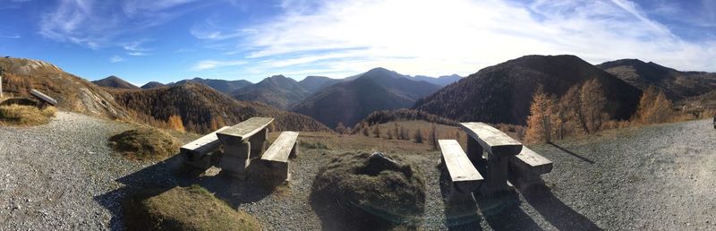 Panoramic view of mountains against cloudy sky