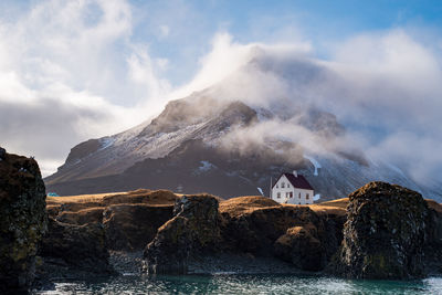 Scenic view of sea and rocks against sky