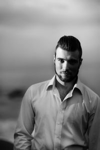 Portrait of young man standing outdoors