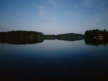 Scenic view of lake against blue sky