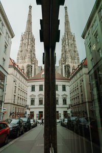 Street amidst buildings in city against sky