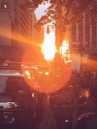 Traffic on city street during sunset