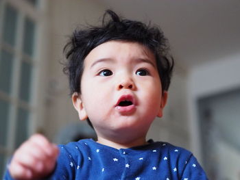 Close-up of cute baby boy at home