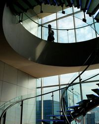 Low angle view of people hanging on ceiling