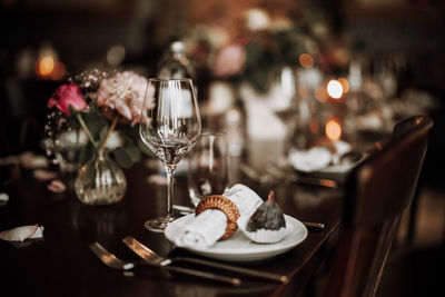 Close-up of wineglasses on table