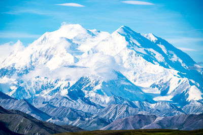 Scenic view of snowcapped mountains against sky