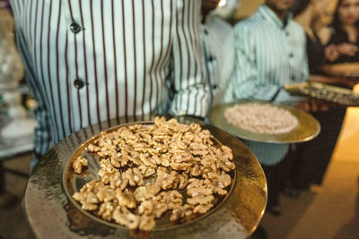 Midsection of man preparing food