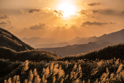 Scenic view of mountains against sky during sunset