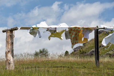 Low angle view of fabrics drying on clothesline