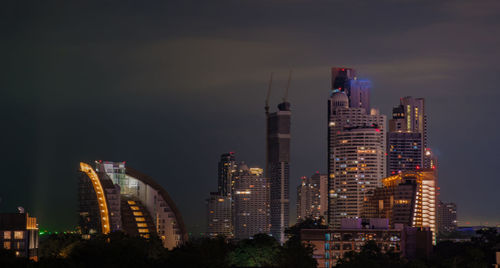 Illuminated buildings in city at night