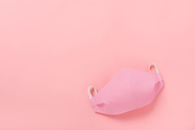 High angle view of heart shape over pink background