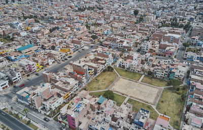 Aerial view of the football field in the middle of a messy neighborhood, callao, lima. peru