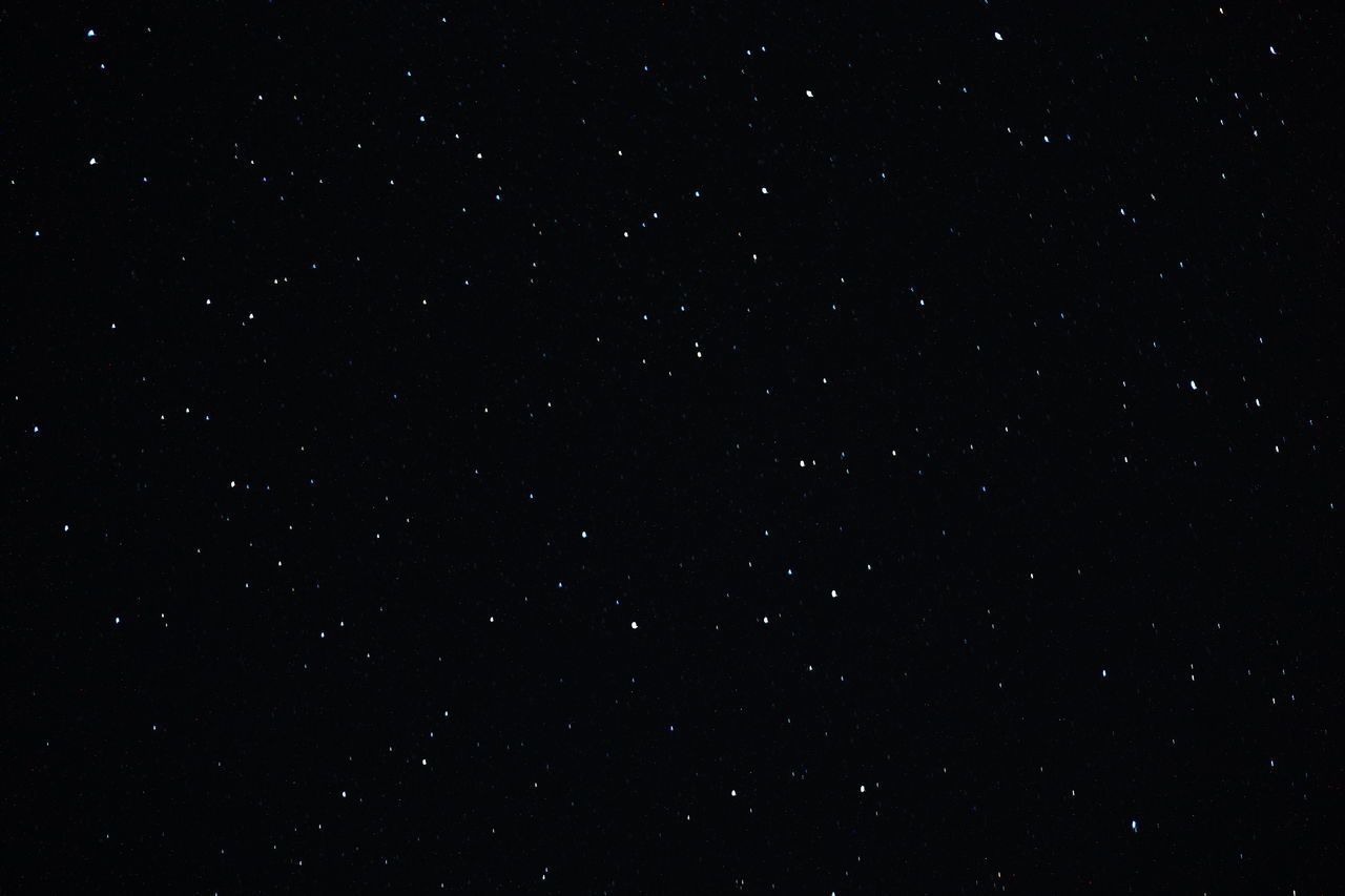 LOW ANGLE VIEW OF STAR FIELD AGAINST SKY