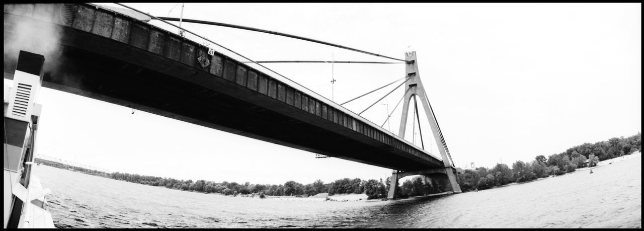 BRIDGE OVER RIVER AGAINST CLEAR SKY