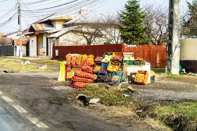 Houses by street against buildings in city