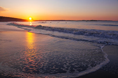 Scenic view of sea against sky during sunset