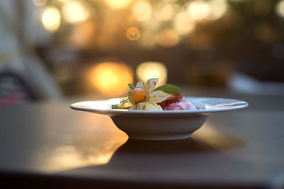 Close-up of fruits in bowl on table 