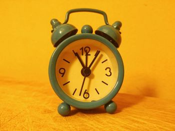 Close-up of clock on table