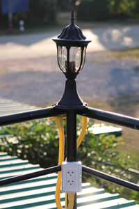 Close-up of electric light on road