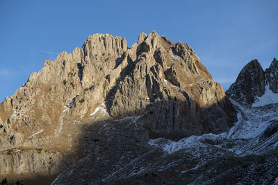 Scenic view of snowcapped mountains against clear sky