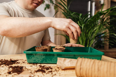 Midsection of man preparing food