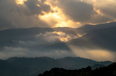 Scenic view of mountains against sky during sunset