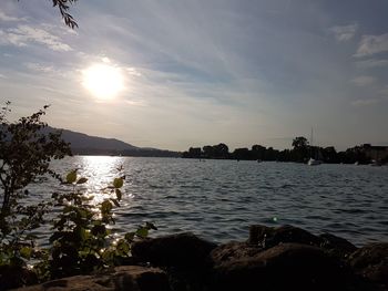 Scenic view of lake against sky during sunset