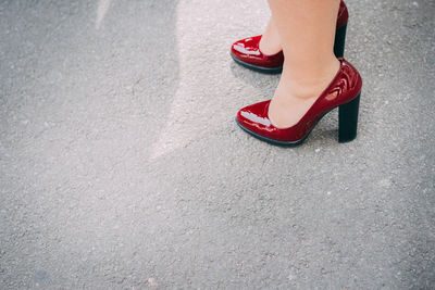 Low section of woman on road