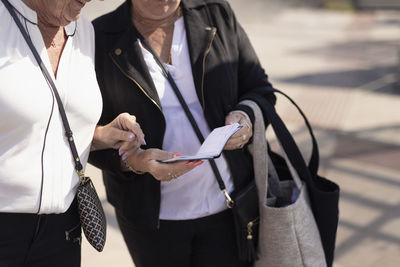 Senior women looking at diary