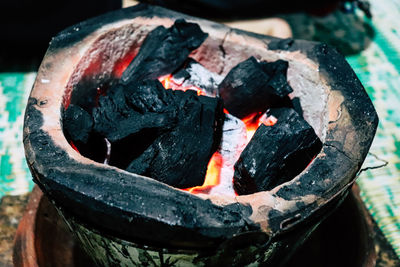 High angle view of fire in charcoal stove