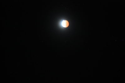 Low angle view of moon against sky at night